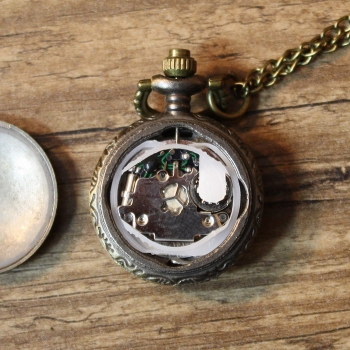 Small pocket watch with tinted glass lid