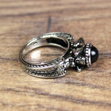 Ring with man and woman in antique style and red hemisphere stone