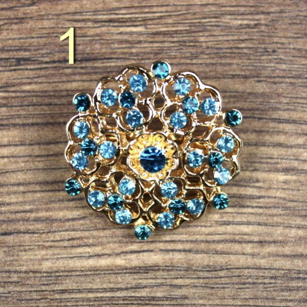 Broschen mit blauen Steinen, Gold / Altgold