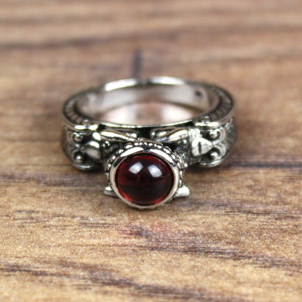 Ring with man and woman in antique style and red hemisphere stone