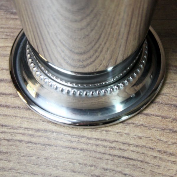 Stainless steel mug with flanged rim